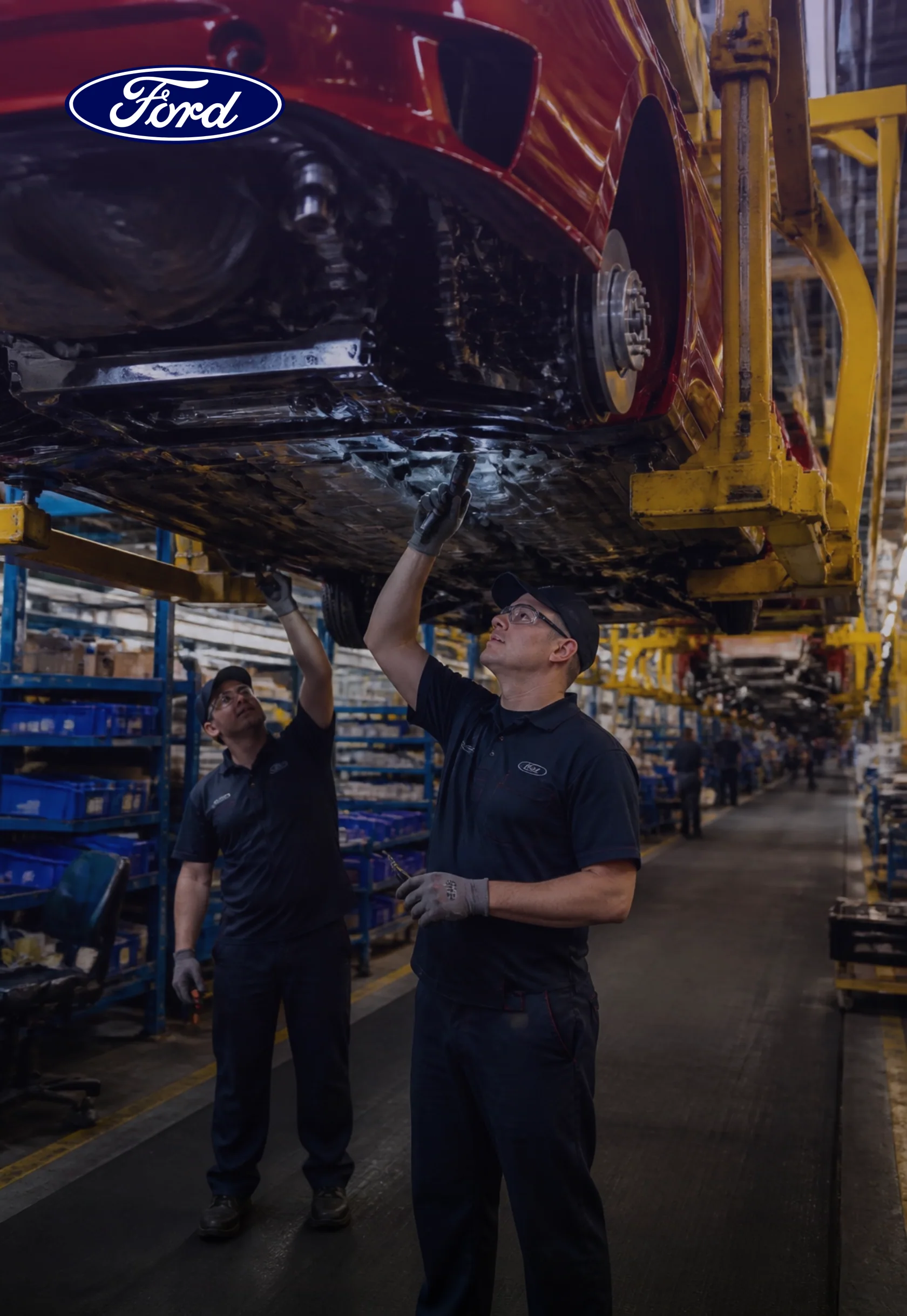Workers inspecting a vehicle on the Ford assembly line