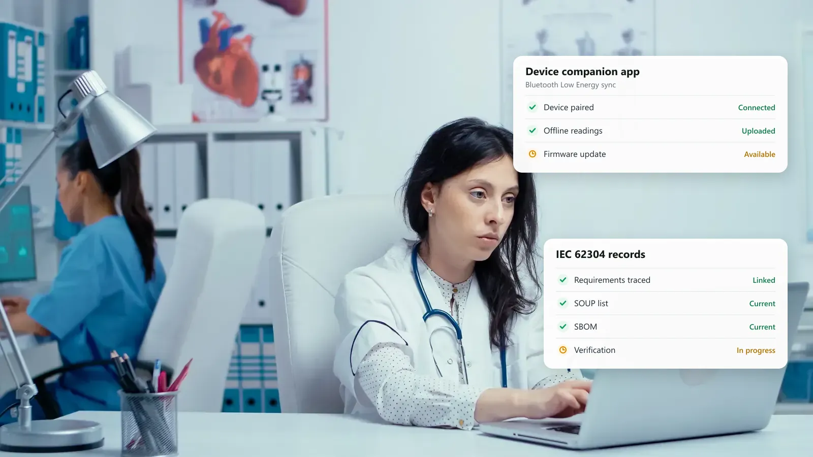 Clinician working at a laptop in a medical device office, with a device companion app sync status and an IEC 62304 records checklist