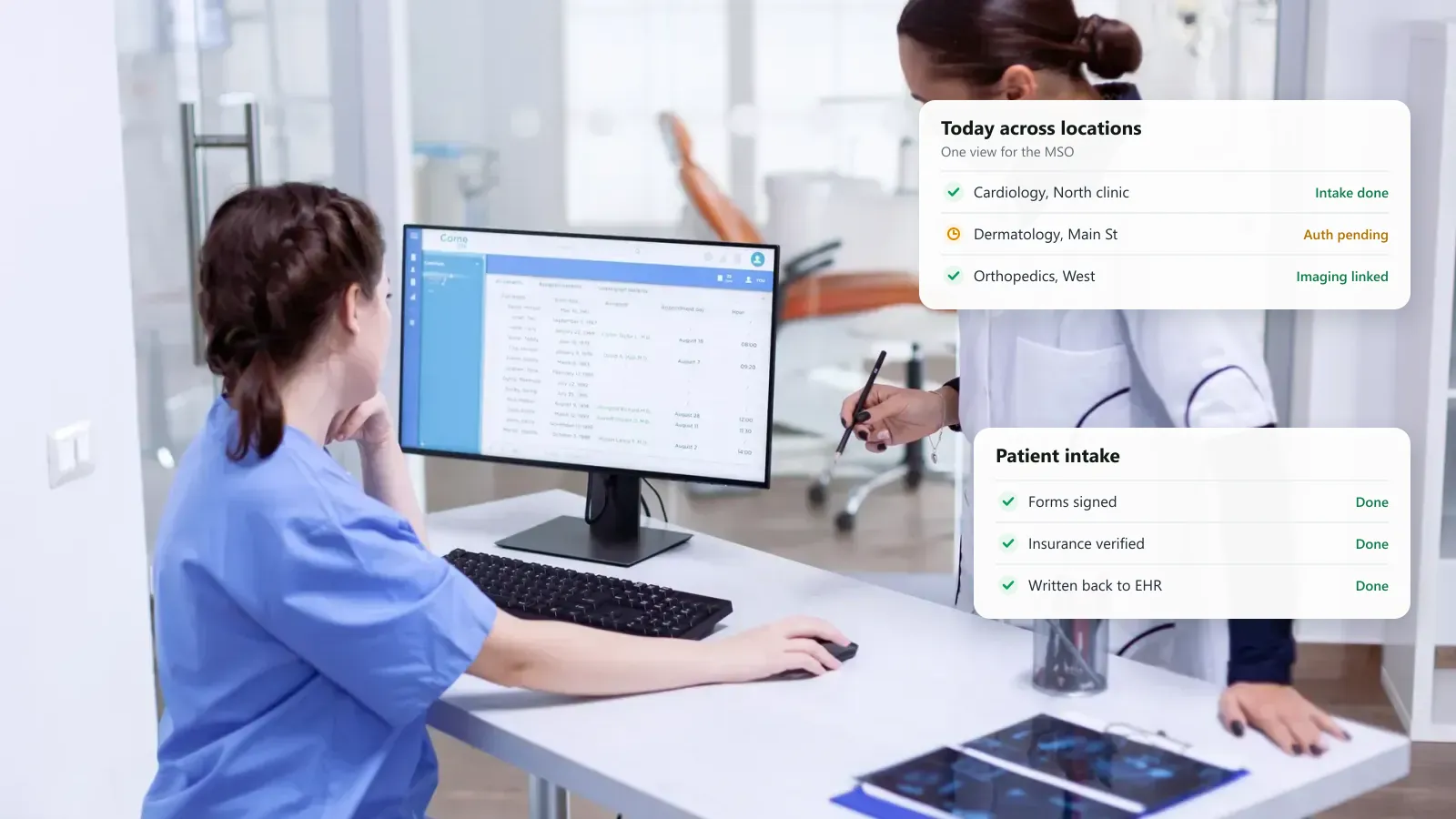Clinic front desk staff working at a scheduling screen, with a multi-location schedule for an MSO and a patient intake status